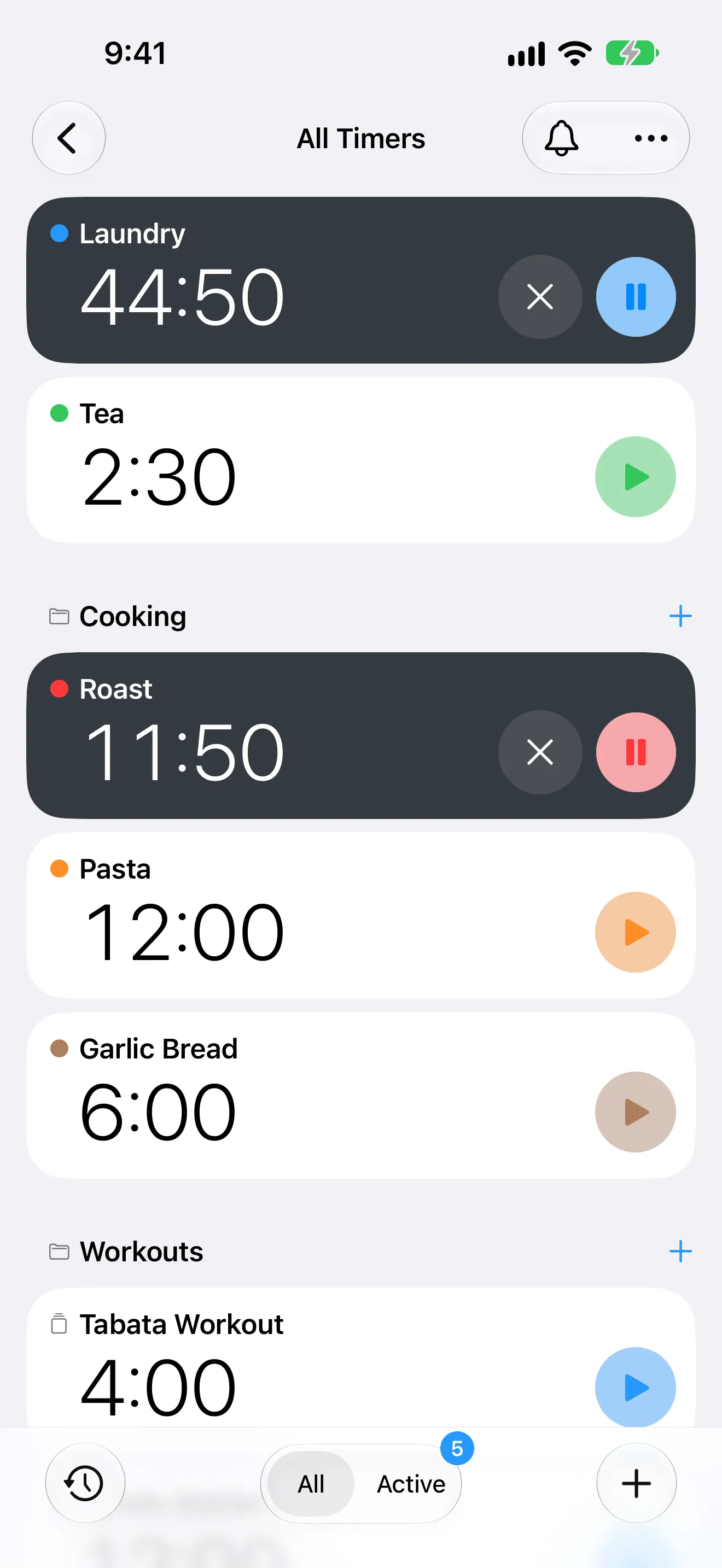Screenshot of Timer+ showing all timers, with a running laundry timer and folders for cooking and workouts.