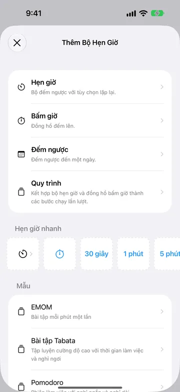 Màn hình Thêm Bộ Hẹn Giờ liệt kê Hẹn giờ, Bấm giờ, Đếm ngược và Quy trình, tiếp theo là hàng Hẹn giờ nhanh và các mẫu quy trình như EMOM, Bài tập Tabata và Pomodoro.