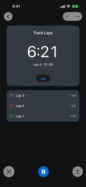 A Stopwatch named Track Laps reading 6:21, with Lap 4 · 01:09 below the reading. The lap list shows Lap 3 at 1:44 with a gray flag, Lap 2 at 1:55 with a red flag, and Lap 1 at 1:32 with a green flag.