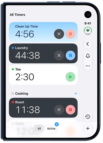 All Timers with a running Kids Timer named Clean Up Time at the top, on a sky-blue card, above the Laundry and Tea timers.